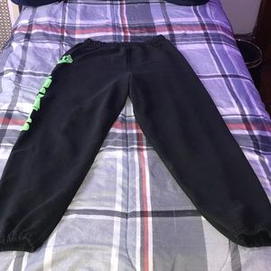 Black joggers with “Wildcats” down the left leg